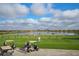 People enjoying the driving range and lake at 13816 Messina Loop # 104, Bradenton, FL 34211