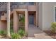 Townhouse front door with a paved walkway and lush landscaping at 13816 Messina Loop # 104, Bradenton, FL 34211
