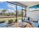 Serene screened-in patio offering beautiful green landscape views and comfortable seating at 13816 Messina Loop # 104, Bradenton, FL 34211