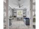 Elegant sitting room boasts gray accent wall, desk, and stylish furniture at 13816 Messina Loop # 104, Bradenton, FL 34211