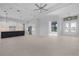 Bright living room featuring tile flooring, recessed lighting, with view into kitchen and decorative front door at 15170 Altura Rd, Port Charlotte, FL 33981