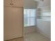 Bedroom with closet and built-in shelves near a bright window at 1804 Baywood Dr, Sarasota, FL 34231