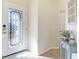 Inviting entryway with decorative glass door and a console table at 20170 Benissimo Dr, Venice, FL 34293