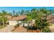 Beautiful townhome with well-kept landscaping, a two-car garage, and a tile roof at 20170 Benissimo Dr, Venice, FL 34293