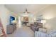 Spacious living room featuring an open floor plan with dining area and kitchen access at 20170 Benissimo Dr, Venice, FL 34293