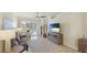 Cozy living room with neutral décor, comfortable seating, and access to the outdoor patio at 20170 Benissimo Dr, Venice, FL 34293