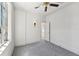 Neutral bedroom featuring carpet, window, and ceiling fan at 210 N 17Th W St # 12, Bradenton, FL 34205