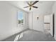 Neutral bedroom featuring carpet, window, and ceiling fan at 210 N 17Th W St # 12, Bradenton, FL 34205