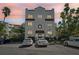 Charming building exterior featuring beautiful architecture, parking and manicured landscaping at 210 N 17Th W St # 12, Bradenton, FL 34205