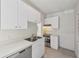This kitchen features ample white cabinets, stainless steel appliances, and a double basin sink at 210 N 17Th W St # 12, Bradenton, FL 34205