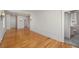 Open living room featuring hardwood floors, classic design, and access to other rooms at 210 N 17Th W St # 12, Bradenton, FL 34205