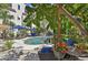 Inviting pool area with lush landscaping and comfortable seating at 210 N 17Th W St # 12, Bradenton, FL 34205
