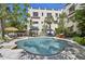 Sparkling pool area with lounge chairs and mature trees at 210 N 17Th W St # 12, Bradenton, FL 34205