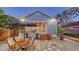 Charming backyard with an outdoor dining area and quaint landscaping at 310 S Osprey Ave, Sarasota, FL 34236