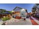 Charming backyard with an outdoor dining area and quaint landscaping at 310 S Osprey Ave, Sarasota, FL 34236
