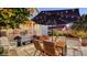Backyard dining area featuring outdoor furniture and garden features at 310 S Osprey Ave, Sarasota, FL 34236