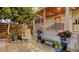 Serene backyard seating area with a cozy rocking chair and vibrant potted plants at 310 S Osprey Ave, Sarasota, FL 34236