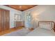 Bright bedroom features a wooden ceiling, wood floors, and a neutral color palette at 310 S Osprey Ave, Sarasota, FL 34236