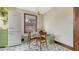 Cozy kitchen nook featuring built-in bench seating, a white table, and vintage refrigerator at 310 S Osprey Ave, Sarasota, FL 34236