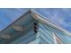 Close-up of exterior architectural detail and construction on the side of the charming blue house at 310 S Osprey Ave, Sarasota, FL 34236