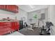 Neatly arranged garage featuring ample storage space, a workout area, and a bright window for natural lighting at 310 S Osprey Ave, Sarasota, FL 34236