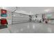 Well-organized garage with a polished floor, bike racks, and tool storage, perfect for hobbyists and storage needs at 310 S Osprey Ave, Sarasota, FL 34236