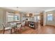 Open kitchen and dining area featuring a center island and modern appliances at 310 S Osprey Ave, Sarasota, FL 34236