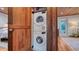 Convenient laundry area with stacked washer and dryer units, seamlessly integrated into the home's design at 310 S Osprey Ave, Sarasota, FL 34236