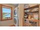 A dedicated laundry area, with a washer and dryer unit, and storage at 310 S Osprey Ave, Sarasota, FL 34236