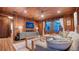 Inviting living room with wooden paneling, stylish furnishings, and natural light at 310 S Osprey Ave, Sarasota, FL 34236