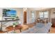 Open-concept living room with wood floors, and a view into the dining area at 310 S Osprey Ave, Sarasota, FL 34236