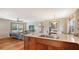 Living space with a kitchen island connecting to the living and dining rooms at 310 S Osprey Ave, Sarasota, FL 34236