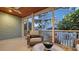 Charming screened-in porch with comfortable wicker seating and a view of the lush backyard at 310 S Osprey Ave, Sarasota, FL 34236