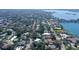Expansive aerial view of a charming neighborhood with lush trees and waterfront access offering a serene and picturesque setting at 3530 Flores Ave, Sarasota, FL 34239