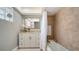 Bright bathroom with a vanity, bathtub-shower combo, and stylish tilework creating a clean and functional space at 3530 Flores Ave, Sarasota, FL 34239