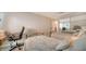Bright bedroom with twin beds, office setup, and mirrored closet doors, providing a spacious feel at 3530 Flores Ave, Sarasota, FL 34239