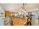 Charming dining room showcasing a rustic table, unique lighting, and a cozy fireplace at 3530 Flores Ave, Sarasota, FL 34239