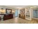 Inviting entryway with hardwood floors, custom storage, a decorative mirror, and stylish decor at 3530 Flores Ave, Sarasota, FL 34239