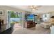 Bright living room with hardwood floors, french doors to the backyard, and modern decor at 3530 Flores Ave, Sarasota, FL 34239