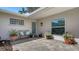 Cozy patio featuring stone flooring, an outdoor bench, and a serene atmosphere perfect for relaxation at 3530 Flores Ave, Sarasota, FL 34239