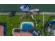 Stunning aerial view of a waterfront property with a pool, lush landscaping, and private boat dock at 364 El Greco Dr, Osprey, FL 34229