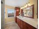 Bathroom with wood vanity at 364 El Greco Dr, Osprey, FL 34229