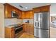 Beautiful kitchen featuring stainless steel appliances, granite countertops, and custom cabinetry at 364 El Greco Dr, Osprey, FL 34229