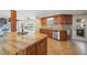 Well-equipped kitchen featuring granite countertops, stainless steel appliances, and ample cabinet space at 364 El Greco Dr, Osprey, FL 34229