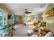 Spacious main bedroom featuring water views, neutral carpet, and a ceiling fan at 364 El Greco Dr, Osprey, FL 34229