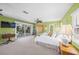 Spacious bedroom with sliding glass doors to deck at 364 El Greco Dr, Osprey, FL 34229