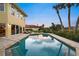 Backyard pool with patio, chairs, tropical landscaping, and a view of the home's exterior at 364 El Greco Dr, Osprey, FL 34229