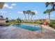 Backyard pool with tiled surround, sun loungers, seating and lush tropical landscaping at 364 El Greco Dr, Osprey, FL 34229