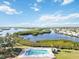 Aerial view of a community pool with coastal waterways at 4528 Fern Dr, Bradenton, FL 34208