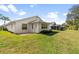 Backyard featuring lawn, garden, and patio at 4528 Fern Dr, Bradenton, FL 34208